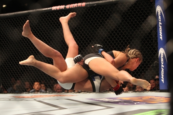 Paige Vanzant, right, takes down Alex Chambers in their bout during UFC 191 at MGM Grand Garden Arena in Las Vegas Saturday, Sept. 5, 2015. Vanzant won by submission. ERIK VERDUZCO/LAS VEGAS REVIE ...