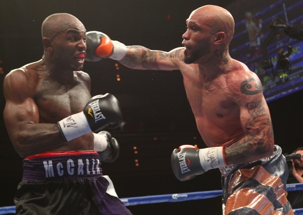 Ishe Smith, right, connects with Cecil McCalla during their junior middleweight fight at The Pearl at the Palms on Thursday, April 30, 2015. Ishe Smith won the fight by unanimous decision. (Chase ...
