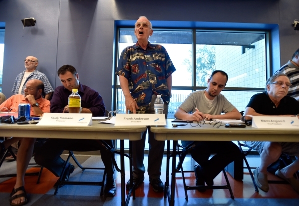 Association president Frank Anderson, center, speaks at a homeowners association meeting for the Silverstone golf course community at the Centennial Hills YMCA in Las Vegas on Tuesday, Sept. 8, 20 ...