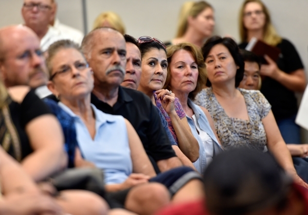 Residents listen to a speaker during a homeowners association meeting for the Silverstone golf course community at the Centennial Hills YMCA in Las Vegas on Tuesday, Sept. 8, 2015. A crowd of seve ...