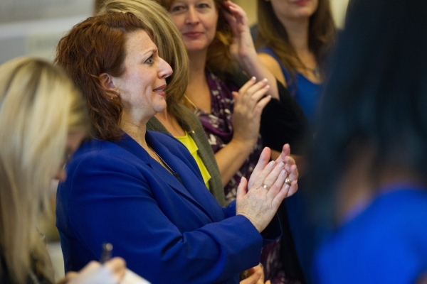 Metro‘s Director of Laboratory Services Kim Murga claps during an announcement that Nevada will receive funding for testing a three-decade backlog of rape kits, at the Sawyer Building in Las ...