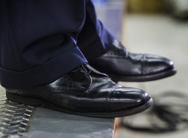 Republican presidential candidate Wisconsin Gov. Scott Walker leans out to the edge of the stage while speaking during a town hall at XTreme Manufacturing Warehouse,1415 West Bonanza Road, on Mond ...