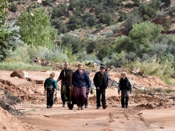 Residents search along the Short Creek bank after a flash flood in Hildale, Utah September 15, 2015. At least eight people were killed near Utah‘s border with Arizona when flash floods trigg ...