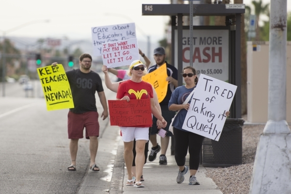 Clark County School District teachers picket outside of the district‘s Edward Greer Education Center in Las Vegas on Thursday, July 2, 2015. (Jason Ogulnik/Las Vegas Review-Journal)