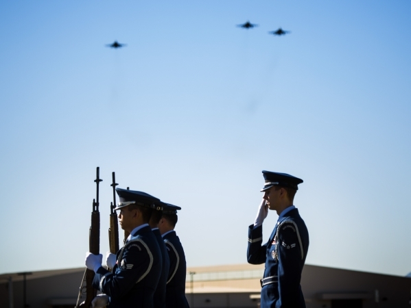 Members of the Nellis Honor Guard stand while the missing man formation is performed during the National POW/MIA Recognition Day at Freedom Park at Nellis Air Force Base on Friday, Sept. 18,2015. ...