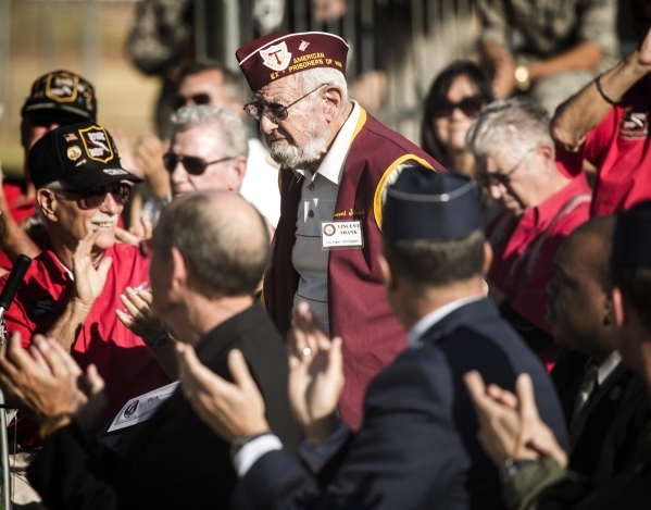 World War II veteran Vincent Shank,99, is applauded during  the National POW/MIA Recognition Day at Freedom Park at Nellis Air Force Base on Friday, Sept. 18,2015. He was a POW from July 5, 1945 u ...