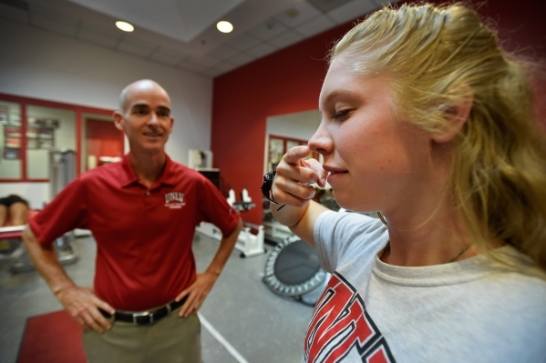 Athletic training student Serena Bruhn, right, receives a balance and coordination test during a demonstration with Tedd Girouard, UNLV‘s director of athletic training, at UNLV on Monday, Se ...