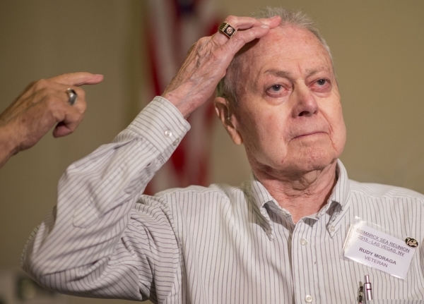 Rudy Moraga, a survivor of the USS Bismarck Sea, shows a scar he received on his head during his reunion at the Plaza Hotel in Las Vegas on Tuesday, Sept. 29, 2015. The USS Bismarck Sea was the la ...