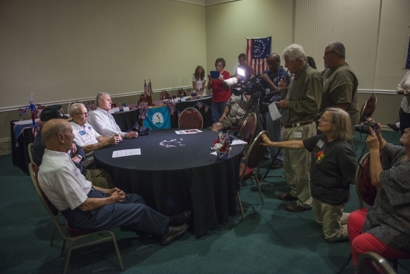 From left, John Papadakis, Dick Miller, Mario Mendes, and Rudy Moraga, survivors of the USS Bismarck Sea meet with members of the media during their reunion at the Plaza Hotel in Las Vegas on Tues ...