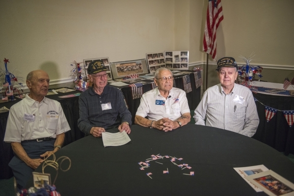 From left, John Papadakis, Dick Miller, Mario Mendes, and Rudy Moraga, survivors of the USS Bismarck Sea meet for their reunion at the Plaza Hotel in Las Vegas on Tuesday, Sept. 29, 2015. The USS  ...