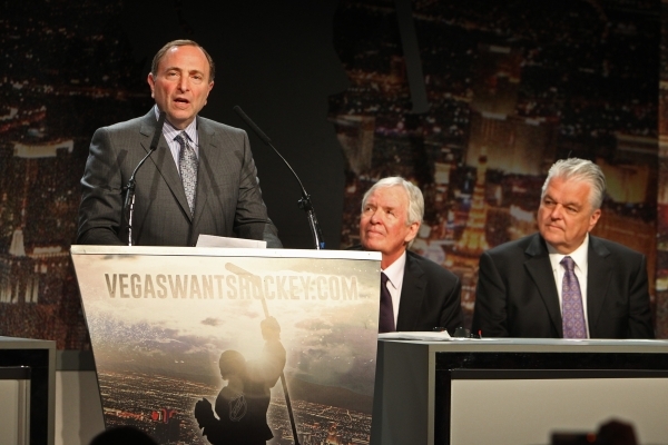 NHL Commissioner Gary Bettman speaks at an event to kick off an NHL ticket deposit drive being held to try and draw an NHL team to Las Vegas Tuesday, Feb. 10, 2015, at the MGM Grand. Listening are ...