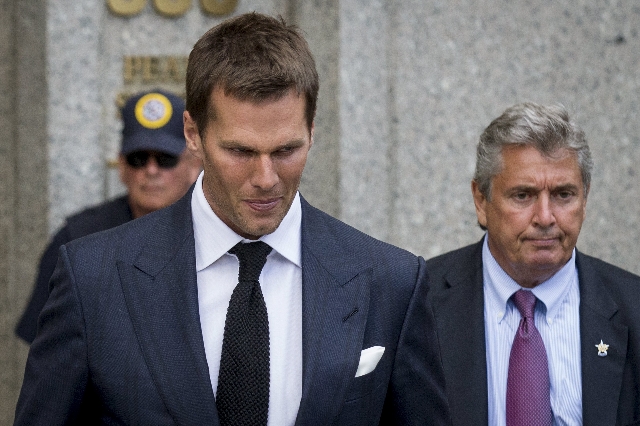 New England Patriots quarterback Tom Brady exits the Manhattan Federal Courthouse in New York August 12, 2015. A federal judge on Wednesday fired tough questions at a National Football League lawy ...