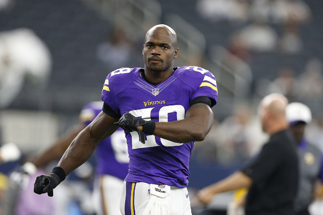 Aug 29, 2015; Arlington, TX, USA; Minnesota Vikings running back Adrian Peterson (28) stretches prior to the game against the Dallas Cowboys at AT&T Stadium. (Matthew Emmons/USA Today Sports)