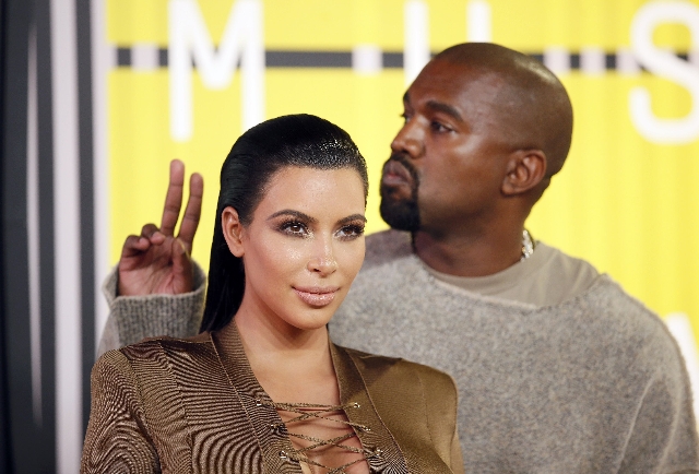 TV personality Kim Kardashian and musician Kanye West arrive at the 2015 MTV Video Music Awards in Los Angeles, California, August 30, 2015.  (Danny Moloshok/Reuters)
