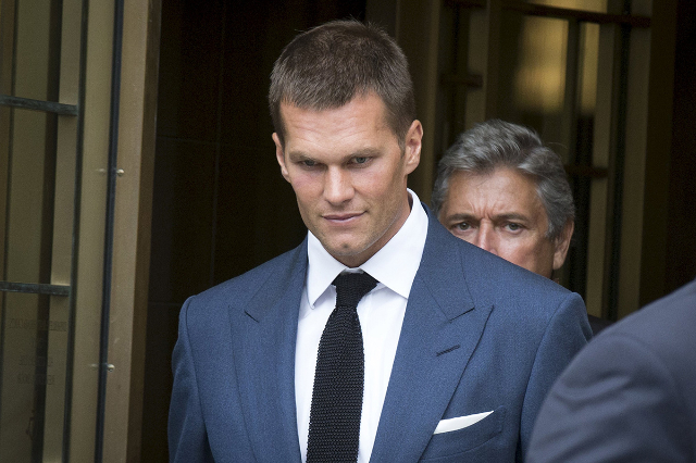New England Patriots quarterback Tom Brady exits the Manhattan Federal Courthouse in New York, August 31, 2015. The National Football League and its players union failed to reach a settlement in t ...