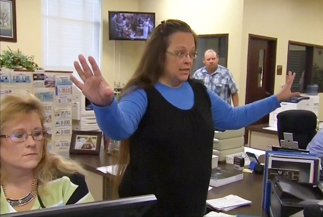 Rowan County Clerk Kim Davis gestures as she refuses to issue marriage licenses to a same-sex couple in Morehead, Kentucky, Sept. 1, 2015. (Still image from WLEX/LEX18.com/Reuters)