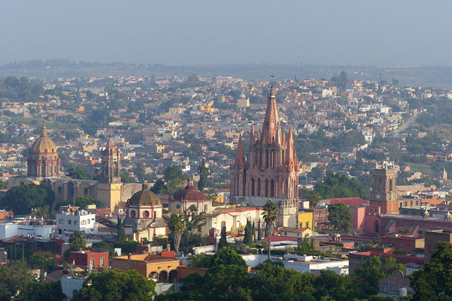 A general view shows landmark churches of San Miguel de Allende, (from L to R) Immaculate Conception, Parroquia and the clock tower marking the Church of the Clock in San Miguel de Allende, Mexic ...