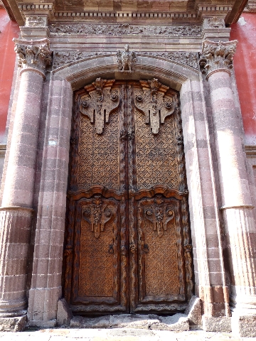A view of the slender fluted shafts frame elaborately carved doors of the 18th-century Canal House mansion, which is considered by UNESCO as an architectural masterpiece for its fusion of baroque ...