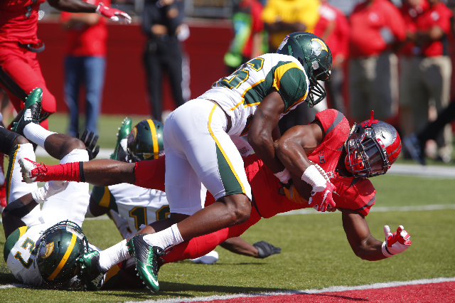 Sep 5, 2015; Piscataway, NJ, USA; Rutgers Scarlet Knights wide receiver Leonte Carroo (4) dives into the end zone before being tackled by Norfolk State Spartans defensive back Leroy Parker (26) du ...