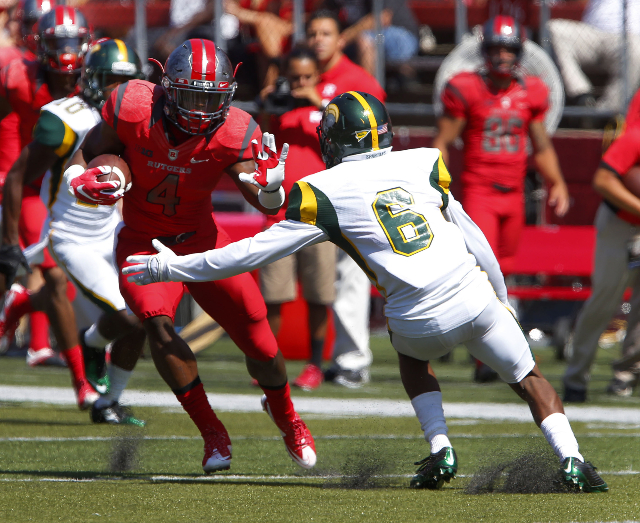 Sep 5, 2015; Piscataway, NJ, USA; Rutgers Scarlet Knights wide receiver Leonte Carroo (4) carries the ball past Norfolk State Spartans defensive back D‘Metrius Williams (6) to score a touchd ...