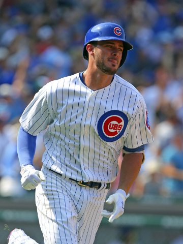 Sep 6, 2015; Chicago, IL, USA;  Chicago Cubs third baseman Kris Bryant (17) runs to first base after hitting a home run during the fifth inning against the Arizona Diamondbacks at Wrigley Field. ( ...