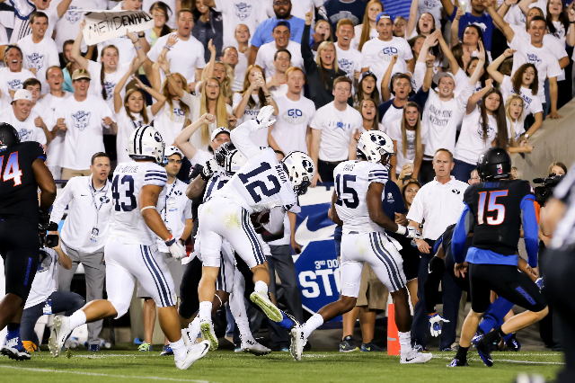 Sep 12, 2015; Provo, UT, USA; Brigham Young Cougars defensive back Kai Nacua (12) dives into the end zone after intercepting the ball during the fourth quarter against the Boise State Broncos at L ...