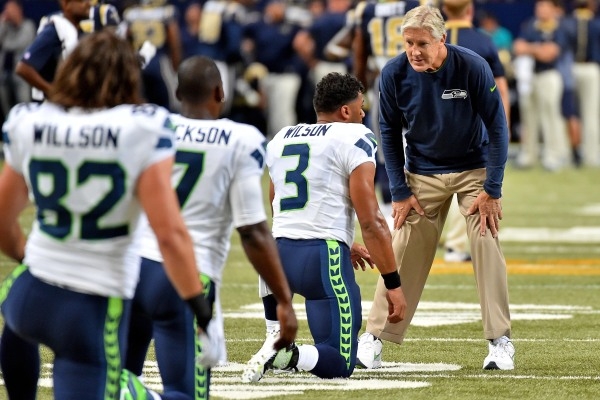 Sep 13, 2015; St. Louis, MO, USA; Seattle Seahawks head coach Pete Carroll and Seattle Seahawks quarterback Russell Wilson (3) talk before the game between the St. Louis Rams and the Seattle Seaha ...