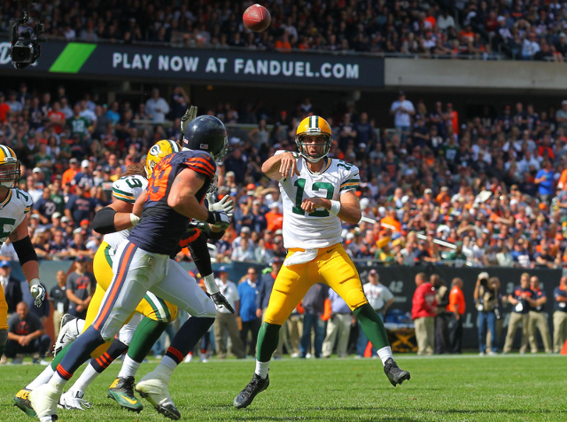 Sep 13, 2015; Chicago, IL, USA; Green Bay Packers quarterback Aaron Rodgers (12) passes the ball during the second half against the Chicago Bears at Soldier Field. Green Bay won 31-23. Mandatory C ...