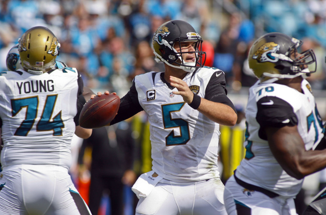 Sep 13, 2015; Jacksonville, FL, USA; Jacksonville Jaguars quarterback Blake Bortles (5) looks for a receiver in the fourth quarter of their game against the Carolina Panthers at EverBank Field. Th ...