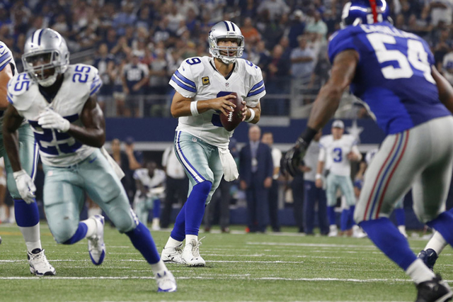 Sep 13, 2015; Arlington, TX, USA; Dallas Cowboys quarterback Tony Romo (9) looks to pass in the fourth quarter against the New York Giants at AT&T Stadium. The Cowboys won 27-26. Mandatory Cre ...