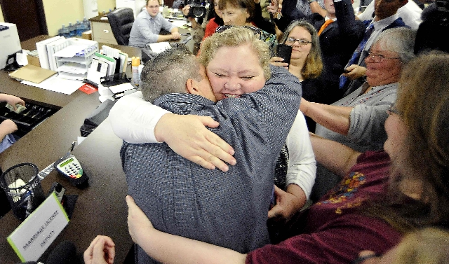 Carmen and Shannon Wampler-Collins hug after they received their marriage license from the Rowan County Clerk‘s Office in Morehead, Kentucky, Sept.r 14, 2015.  (Chris Tilley/Reuters)