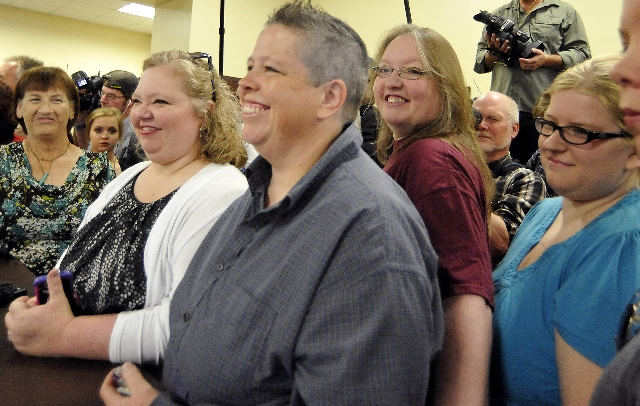 Carmen, second left, and Shannon Wampler-Collins wait to receive their marriage license at the Rowan County Clerk‘s Office in Morehead, Kentucky, Sept. 14, 2015.  (Chris Tilley/Reuters)