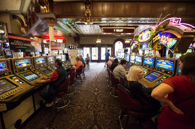 People play on slot machines at the Main Street Station hotel-casino in downtown Las Vegas on Tuesday, May 26, 2015. The Internal Revenue Service has proposed lowering the reporting level for gamb ...