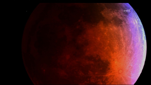 Sky gazers caught a glimpse of the "blood moon" crossing the Earth‘s shadow Tuesday. April 15, in all its splendor. The moon took on a reddish hue as it appeared in different phase ...