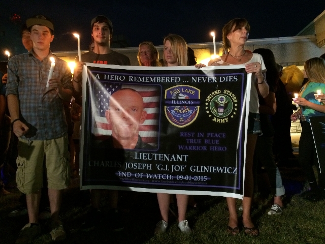 Residents and fellow police officers gather at the Fox Lake, Illinois Police Department on September 2, 2015, to remember the life of Lt. Joe Gliniewicz. Gliniewicz was shot and killed on Tuesday  ...