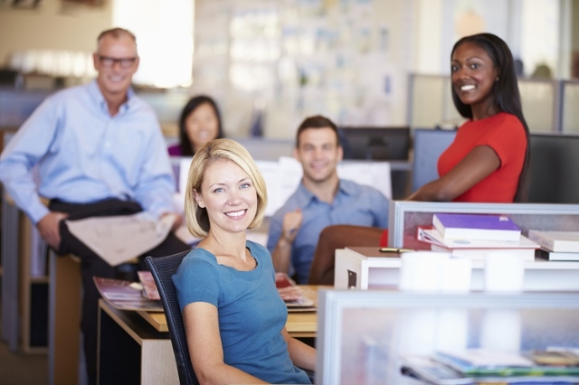 Portrait Of Businesspeople In Modern Open Plan Office (Thinkstock)