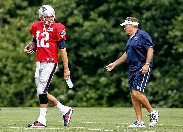 Aug 6, 2015; Foxborough, MA, USA; New England Patriots quarterback Tom Brady (12) talks with New England Patriots head coach Bill Belichick during training camp at Gillette Stadium. (Winslow Towns ...
