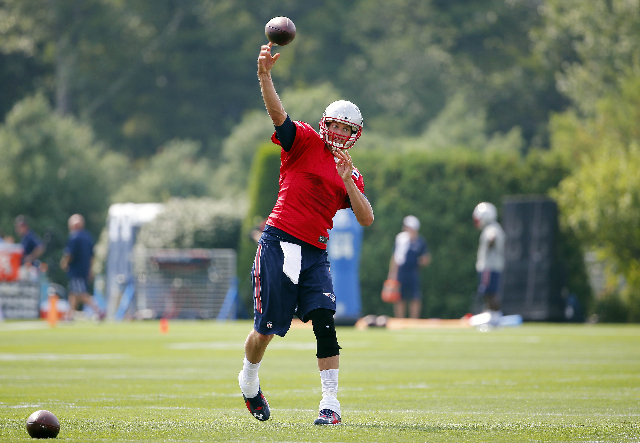 Jul 30, 2015; Foxborough, MA, USA; New England Patriots quarterback Tom Brady (12) throws during training camp at Gillette Stadium. (Winslow Townson-USA Today Sports)