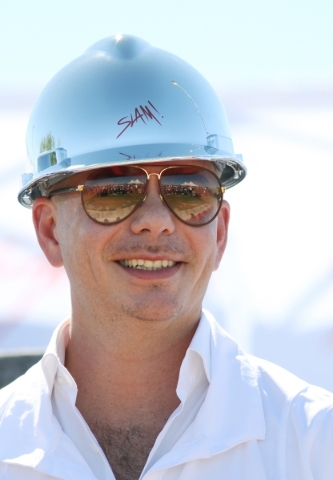 Rapper Pitbull attends a groundbreaking ceremony for Sports Leadership and Management (SLAM!) charter middle and high school Friday, Oct. 2, 2015, near the Russell Road Recreation Complex in Hende ...