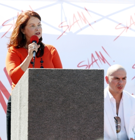 Henderson Mayor Pro Tem Debra March, left, speaks near rapper Pitbull during a groundbreaking ceremony for Sports Leadership and Management (SLAM!) charter middle and high school Friday, Oct. 2, 2 ...