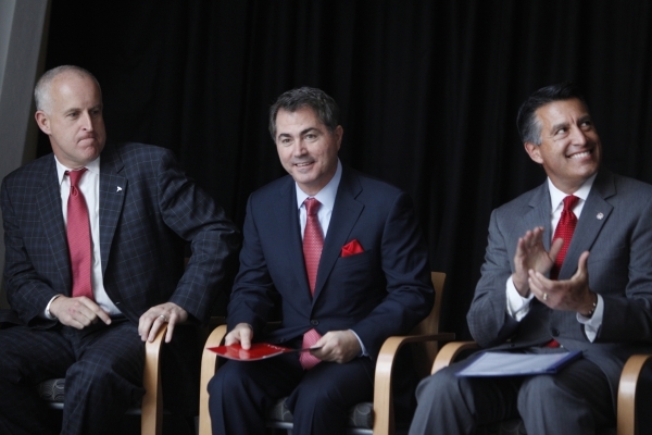 Diarmuid O‘Connell, from left, vice president at Tesla, Len Jessup, president at UNLV, and Gov. Brian Sandoval, participate during a press conference at the UNLV Science and Engineering Buil ...