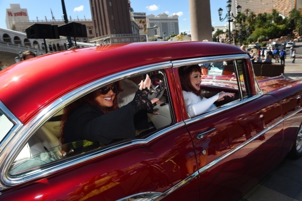 Naomi and Wynonna Judd leave in a 1957 Chevy after an appearance at the Venetian to publicize their nine-show residency Tuesday, Oct. 6, 2015. Sam Morris/Las Vegas News Bureau
