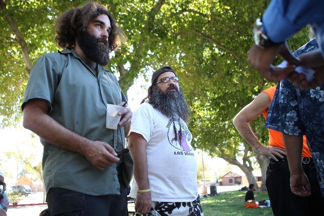 "Ballentine", left, and Kelly Patterson, volunteers with Food Not Bombs, voice their concerns with their use of the park with David Lopez, advisory commissioner with the City of Las Vega ...