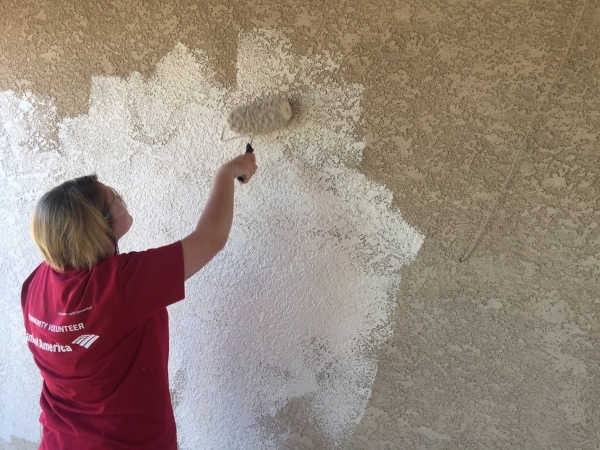 A volunteer paints the outside of a Henderson home Oct. 10, 2015. Approximately 25 Bank of America employees painted the exterior of two homes in Henderson as part of Habitat for Humanity Las Vega ...