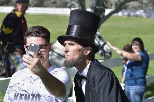 Marco Cacciotti, left, takes a selfie with Robert Broski as Abraham Lincoln at Spring Mountain Ranch State Parkon Saturday, Oct. 24, 2015. (Bill Hughes/Las Vegas Review-Journal)