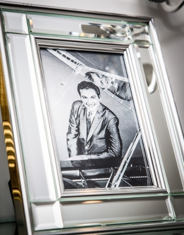 A young Liberace poses at the piano in a photograph on display at the Liberace Mansion.
TONYA HARVEY/REAL ESTATE MILLIONS