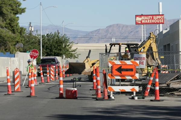 A worker controls traffic on Yale Street near Decatur Boulevard and Washington Avenue while construction begins on a two-story building for the VCA Decatur Animal Hospital, across from the Las Veg … | A worker controls traffic on Yale Street near Decatur Boulevard and Washington Avenue while construction begins on a two-story building for the VCA Decatur Animal Hospital, across from the Las Veg … |