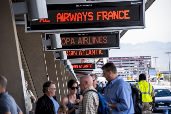 Travelers are seen checking into international airlines at McCarran International Airport in Las Vegas on Tuesdsay, Oct. 27, 2015. Joshua Dahl/Las Vegas Review-Journal
