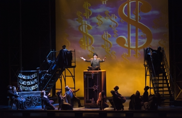 Todd Berkich, as J.P. Morgan, seated on safe, performs with other cast members from ìRagtimeî at Reynolds Hall in the Smith Center for the Performing Arts at 361 Symphony Park Ave. in Las Ve ...