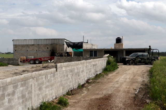 Soldiers guard the site where a tunnel, connected to the Altiplano Federal Penitentiary and used by drug lord Joaquin ‘El Chapo‘ Guzman to escape, was located in Almoloya de Juarez, on ...
